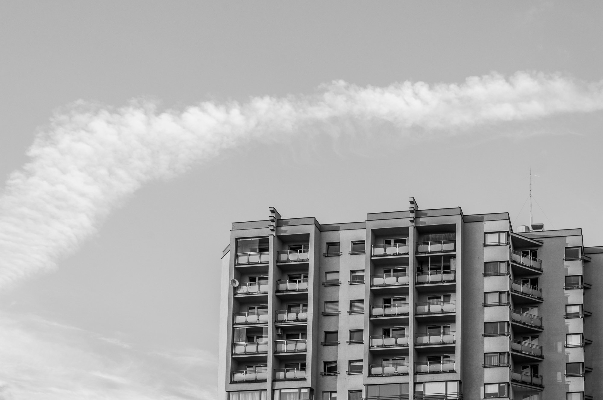 Adam Mazek Photography Warsaw 2018. Minimalism. Cloud over block of flat.