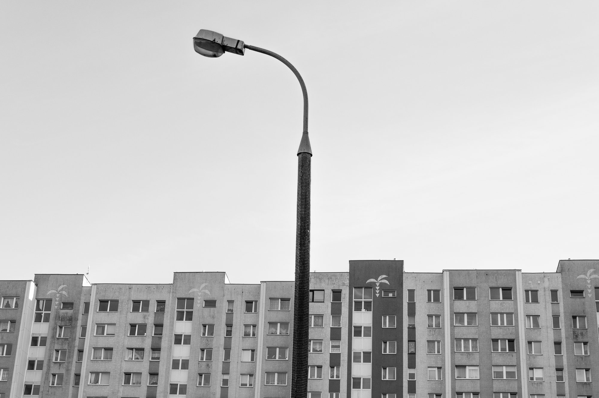 Adam Mazek Photography Warsaw 2020. Post: "Faithfulness." Minimalism. Street lamp and block of flats.