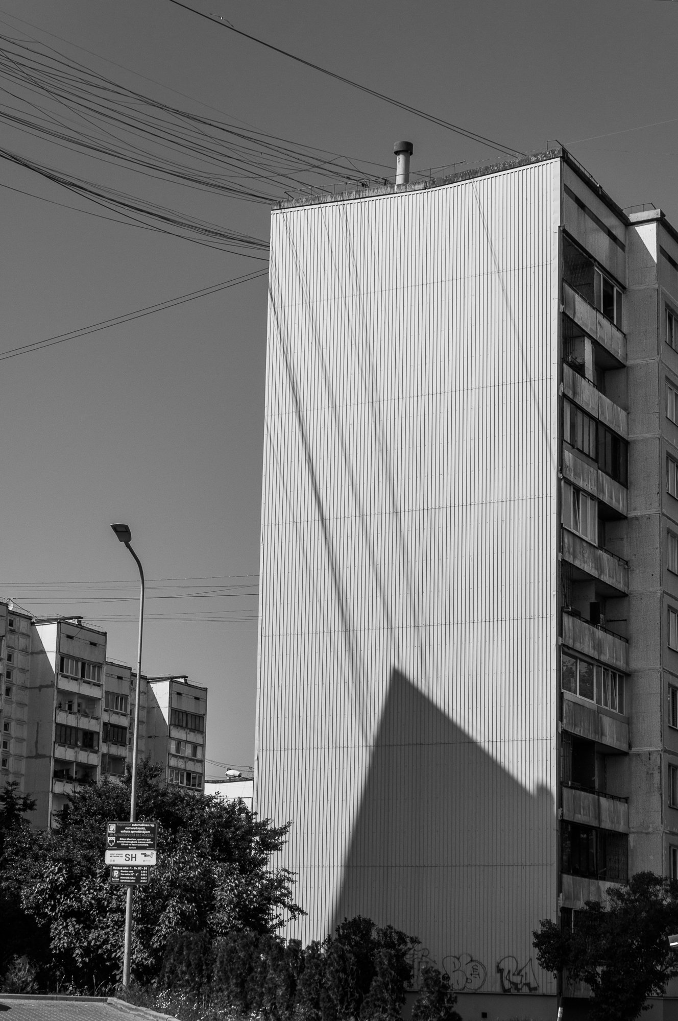 Adam Mazek Photography 2021. Post: "What do I believe in?" Minimalism. Riga street photography. Shadow.