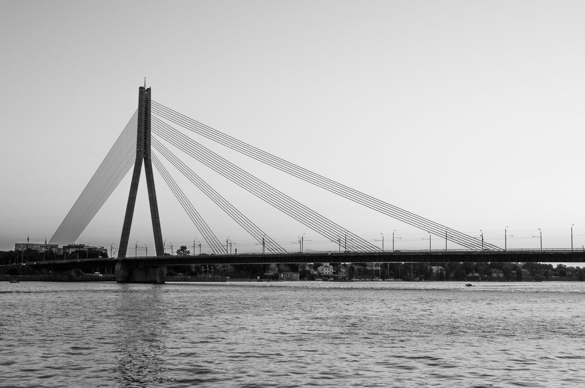Adam Mazek Photography 2021. Post: "Drink water!" Riga street photography. Minimalism. Bridge over Daugava river.