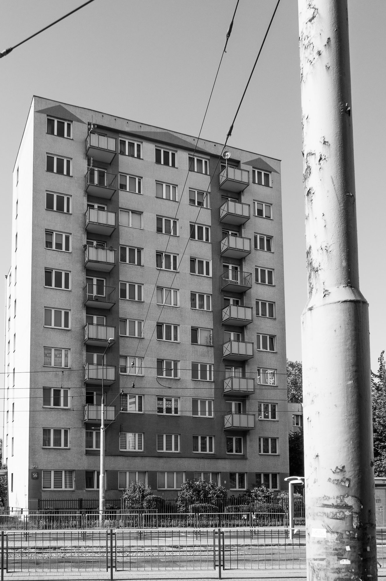 Adam Mazek Photography 2022. Warsaw Street Photography. Post: "Mindless consumerism." Minimalism. Street lamps.