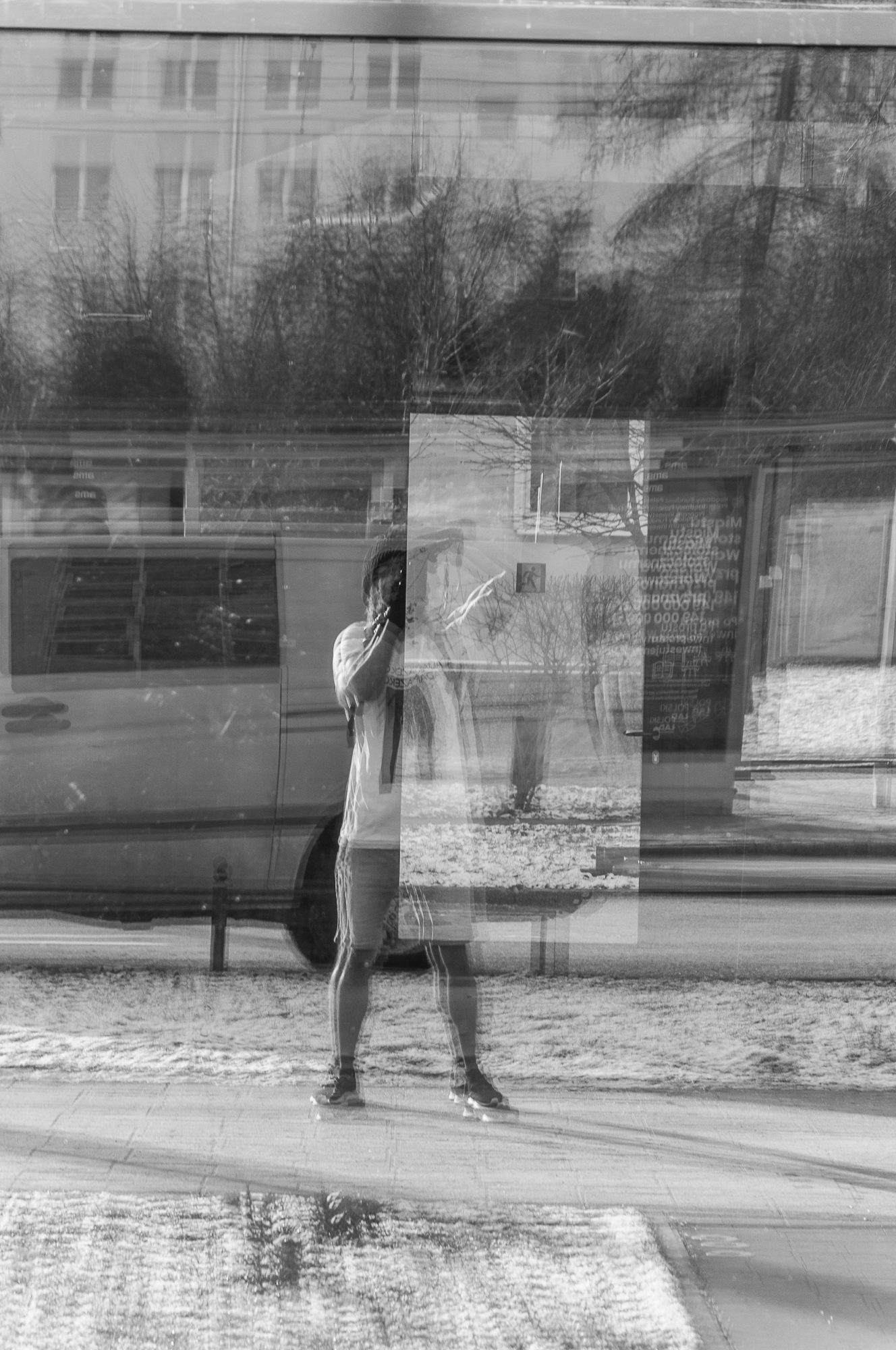 Adam Mazek Photography 2022. Warsaw Street Photography. Post: "Music albums for walking in the cold." Minimalism. Selfie.